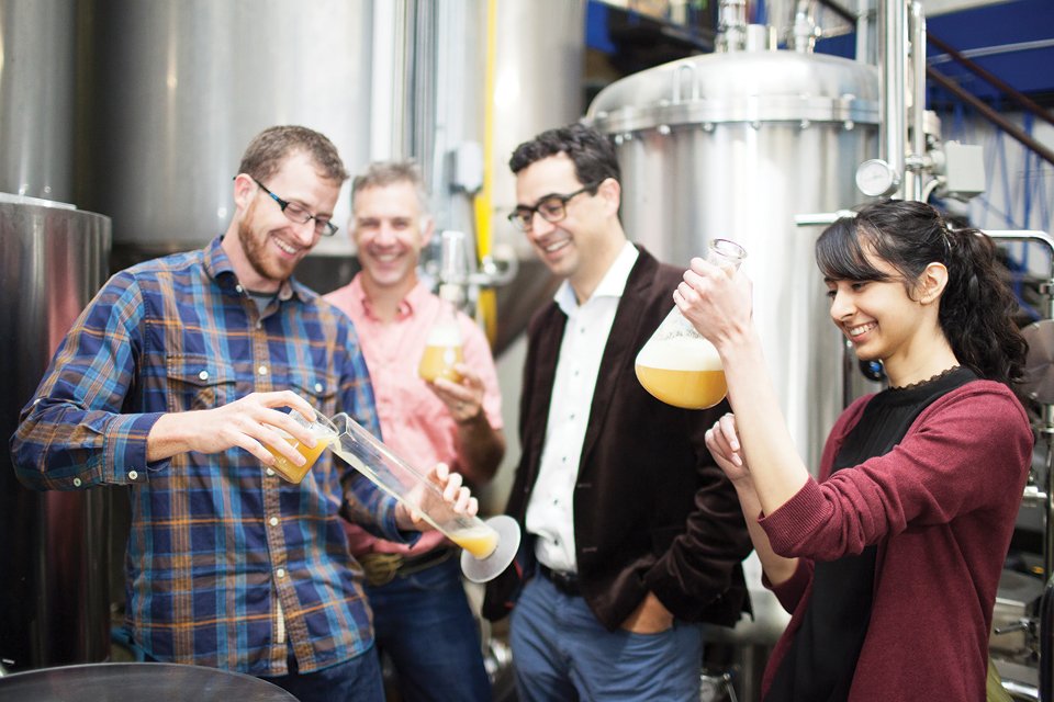 L-R: Thomson, Phillips Brewing president Matt Phillips, Hof and research assistant Aman Dheri at Phillips Brewing. UVic Photo Services.